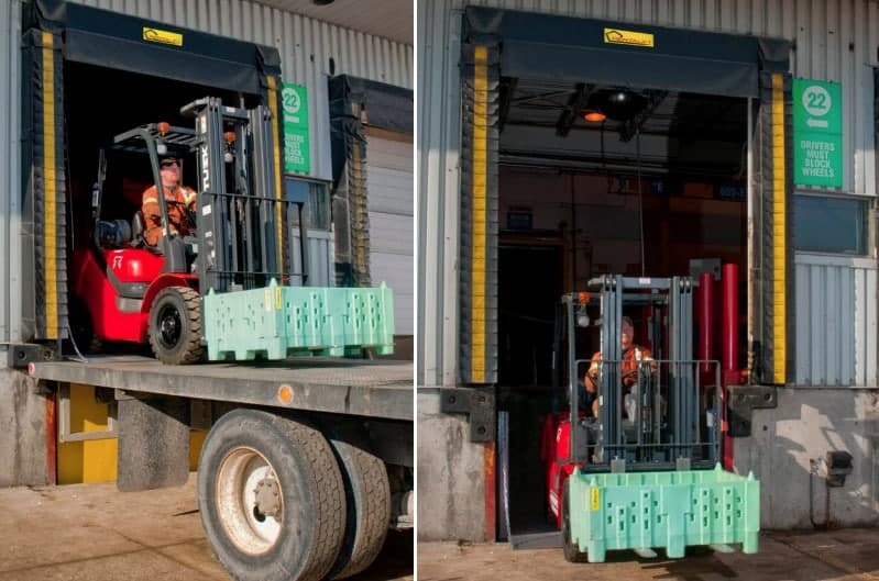 A worker operates a red forklift, moving a green crate from a truck to a loading dock labeled 22 at a warehouse. The forklift driver wears a safety vest and helmet.